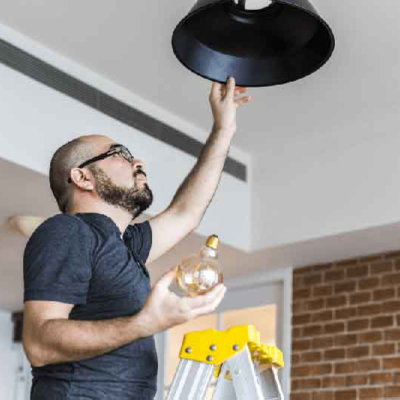 man-changing-light-bulb